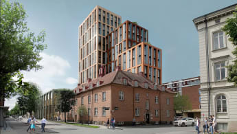 Visionsbild med Science Park Towers i Jönköping, höga hus vid sidan av vägen.