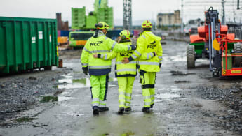 A worker takes a wide look at a construction site.