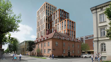 Visionsbild med Science Park Towers i Jönköping, höga hus vid sidan av vägen.