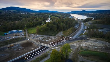 Railway construction underway across a mountainous region in Eidsvoll, Norway.