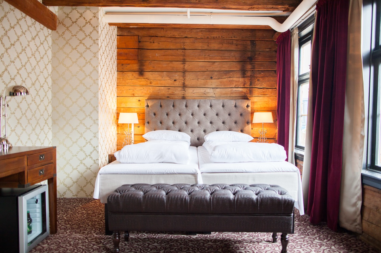 Hotel bedroom with tufted headboard