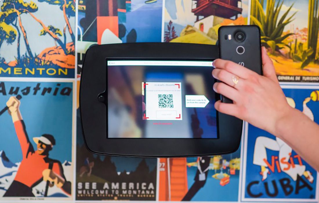 Someone scanning a QR code using their mobile phone