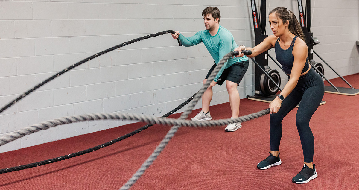 Class instructors exercise using ropes.