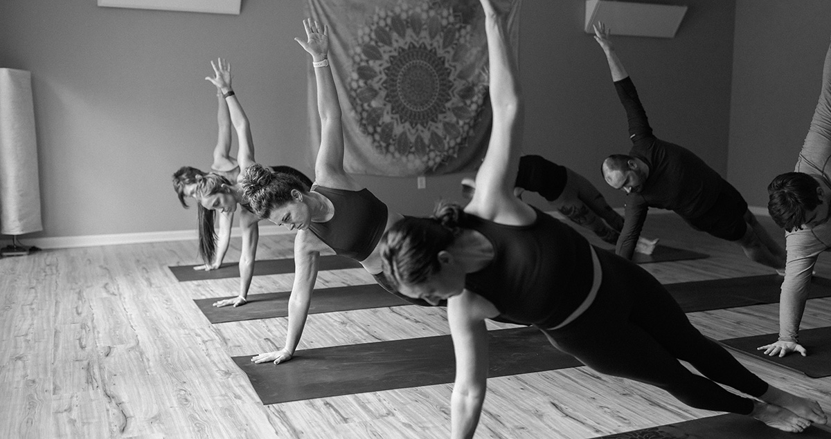 A class yoga poses in the studio.