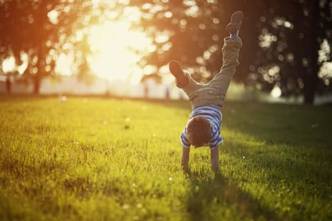 Child doing a somersault