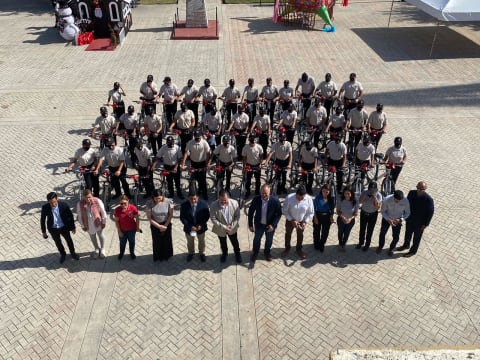 Community leaders with donated bicycles