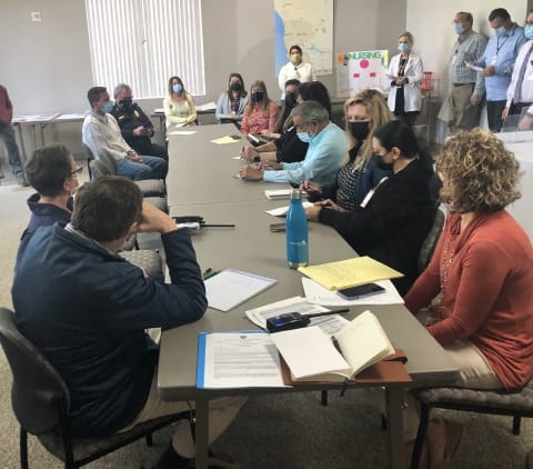 People in crisis command center