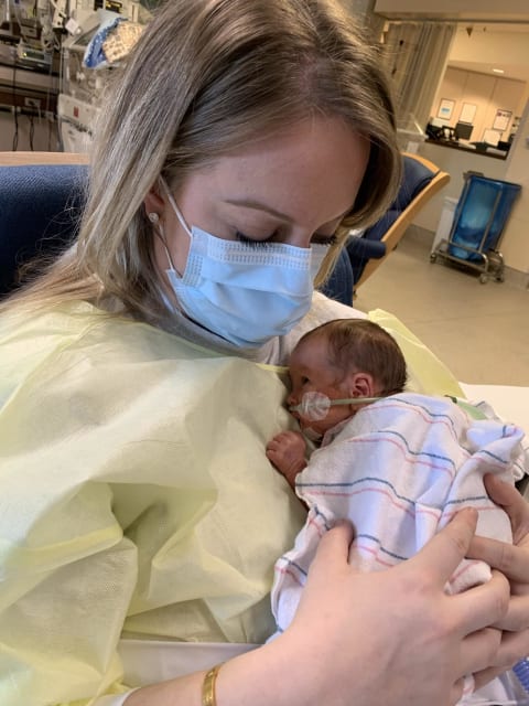 Chelsea holding Jack in NICU