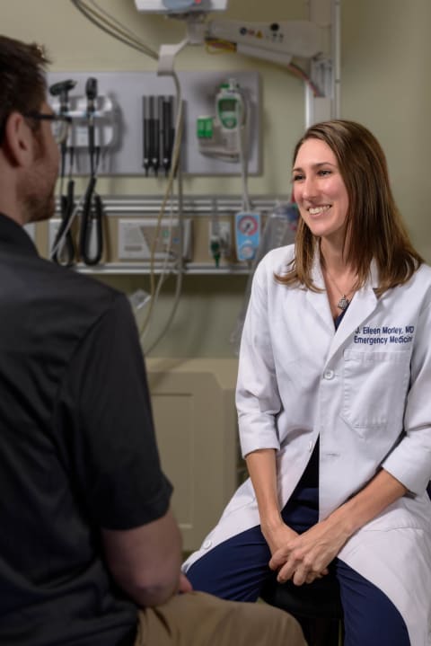 Physician talking with patient in ER
