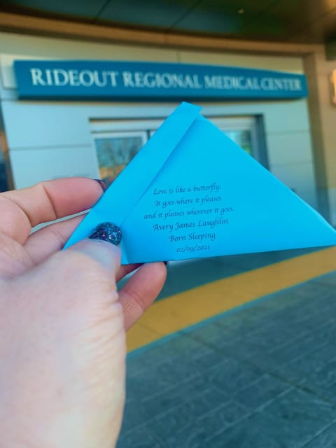 Hand holding a printed poem
