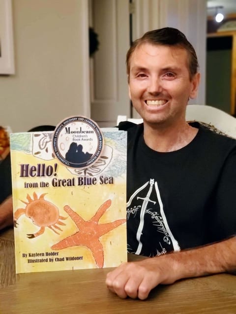 Chad holding book