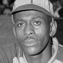 Pitcher Satchel Paige Standing in Dugout