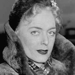 Christine Jorgensen as she walks to Customs and Public Heath