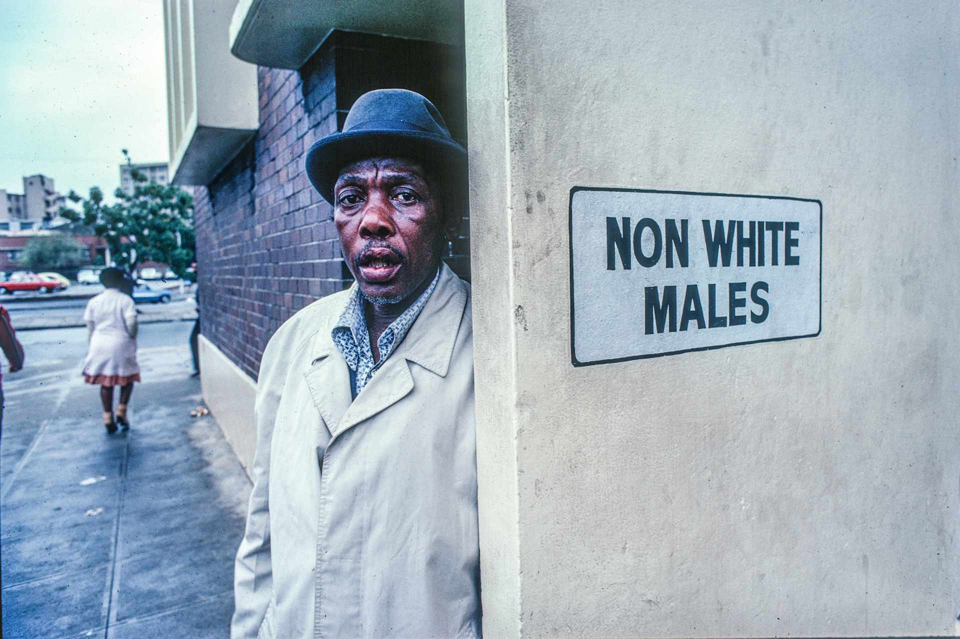 Man Outside A Segregated Restroom