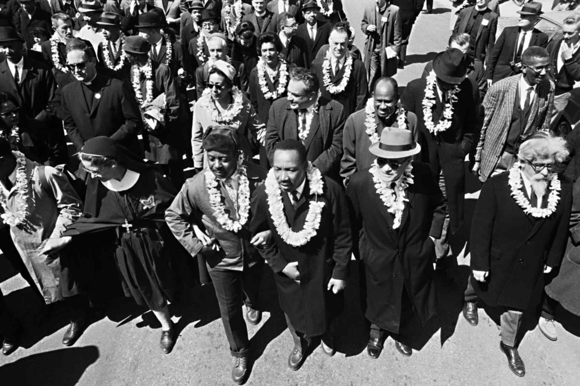 Dr. Martin Luther King, Jr.leading marchers as they begin the Selma to Montgomery civil rights march from Brown's Chapel Church in Selma, Alabama. (Credit: Bettmann Archive/Getty Images)