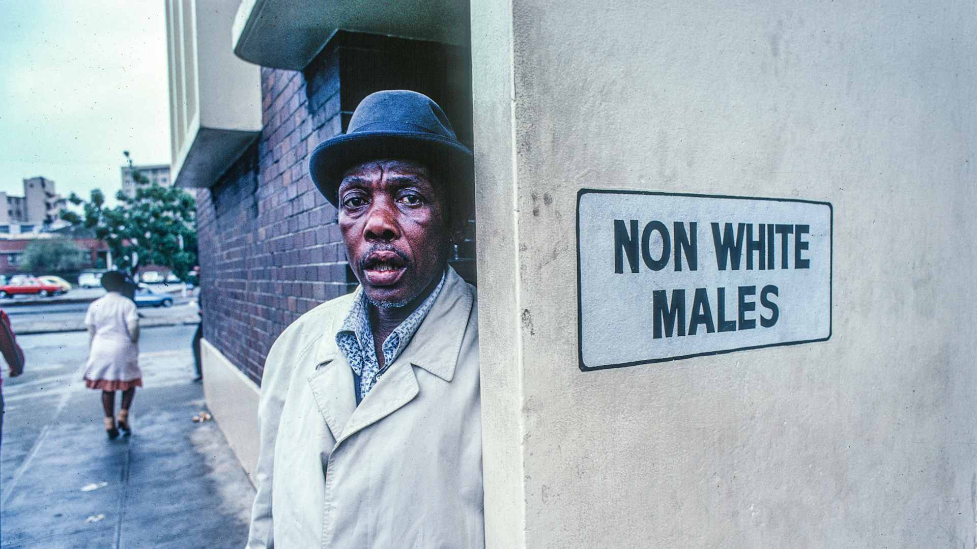Man Outside A Segregated Restroom