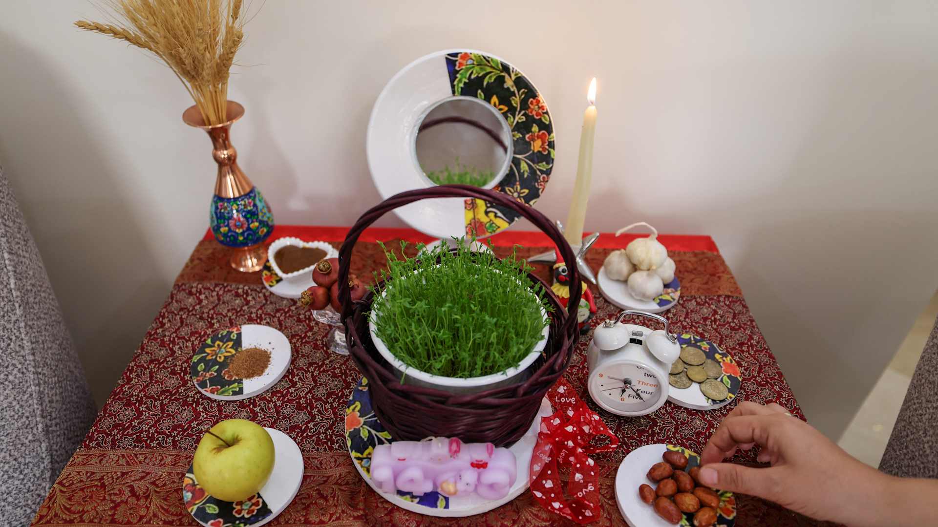 A table laid out with traditional items for the Iranian festival of Nowruz: 