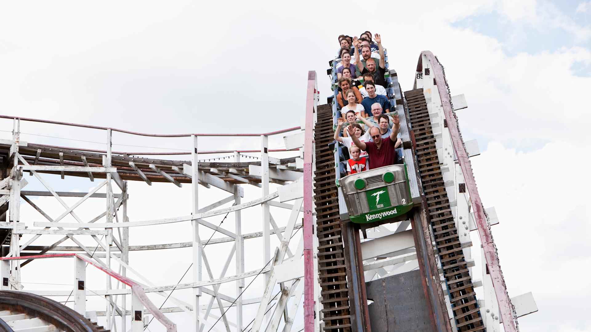 People riding rollercoaster