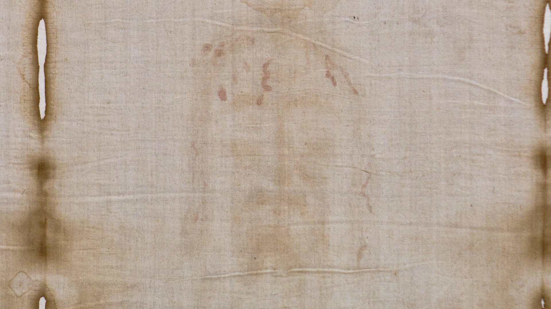 The Shroud of Turin, a linen cloth bearing the faint image of a man, believed by some Christians to be Jesus' burial shroud.