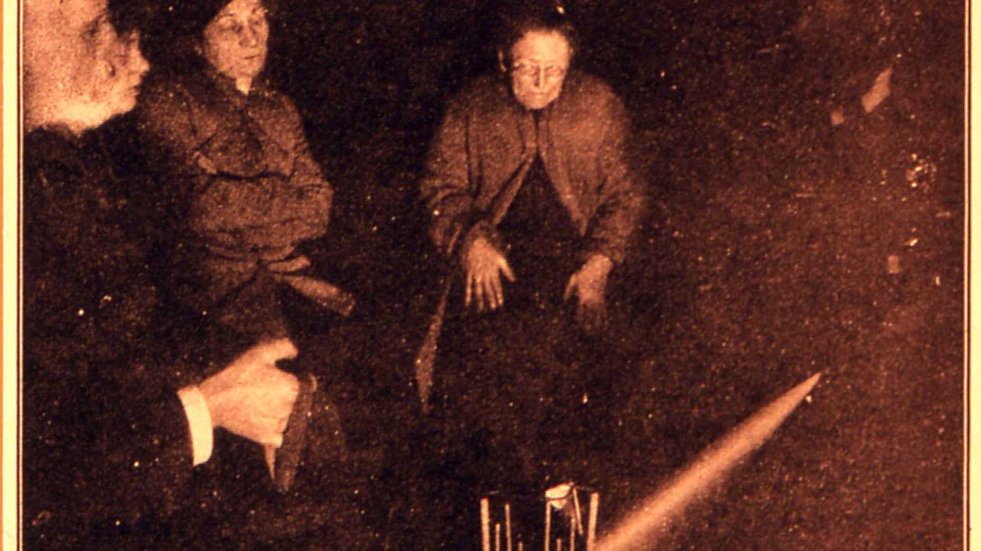 Seance. Levitating trumpet etc. Flash photograph revealing seance trumpet falling. The tambourine had floated to the top of the trumpet, and presumably knocked it over. Seance held march 1st 1929.