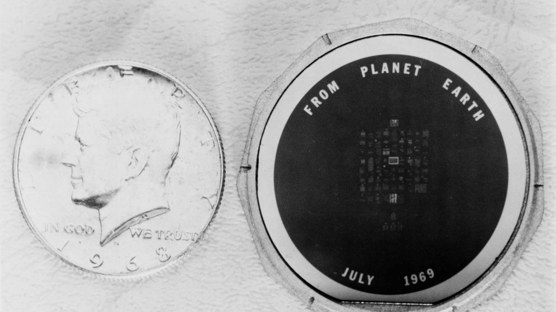 Disc left on the moon with inscription.