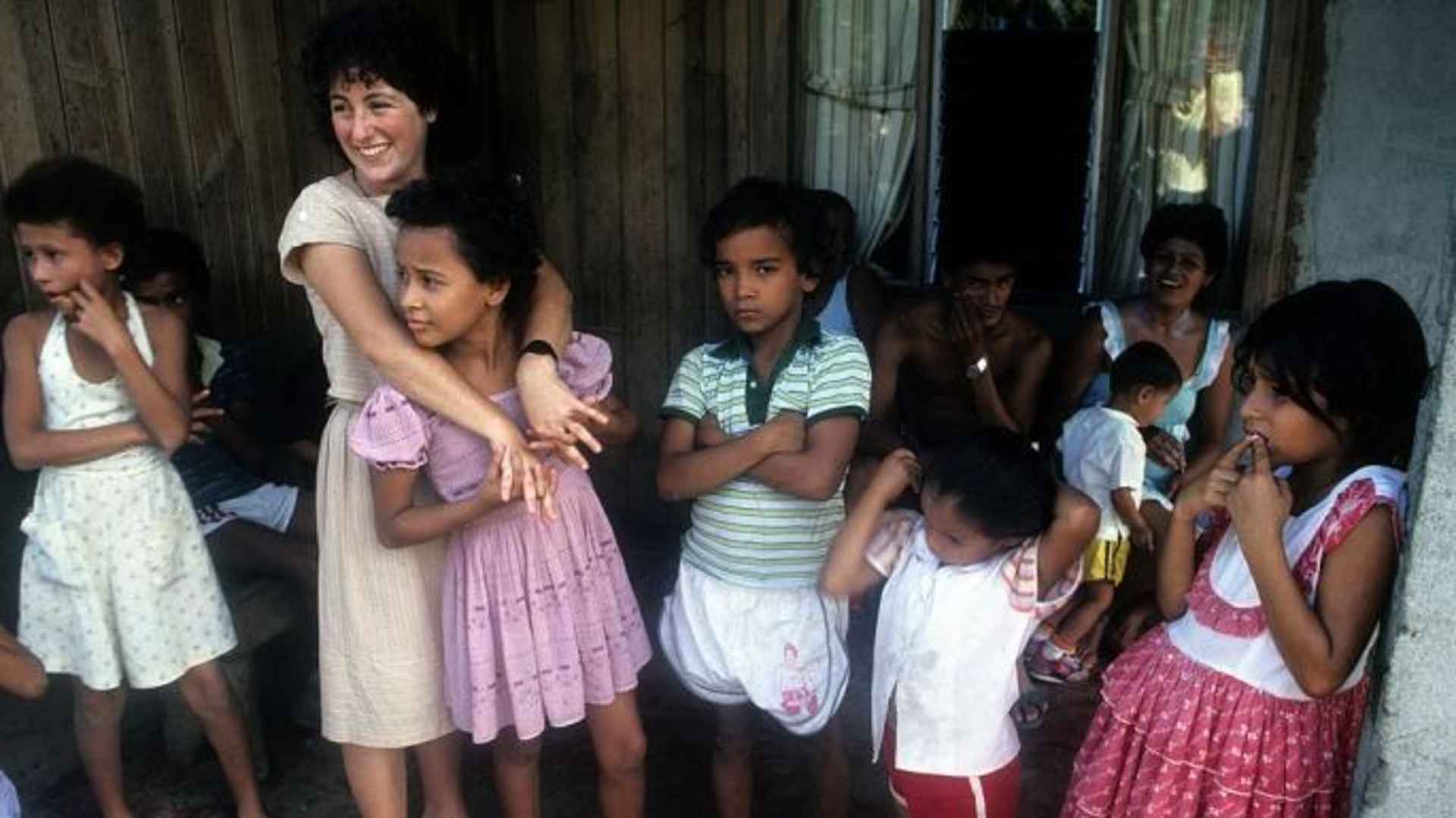 A Peace Corps volunteer and children in Costa Rica, c. 1985.