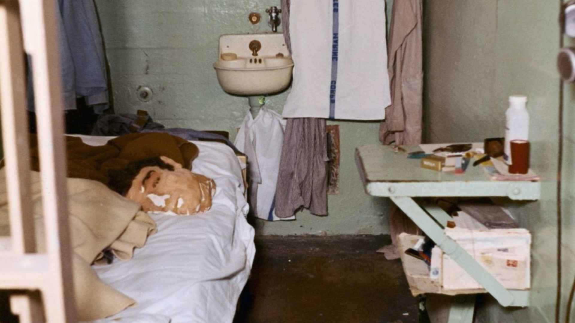 A photograph showing the cell where one of the three prisoners escaped from Alcatraz on June 12, 1962. A dummy head was used to throw off guards, and sheets were used to conceal his exit below the sink.