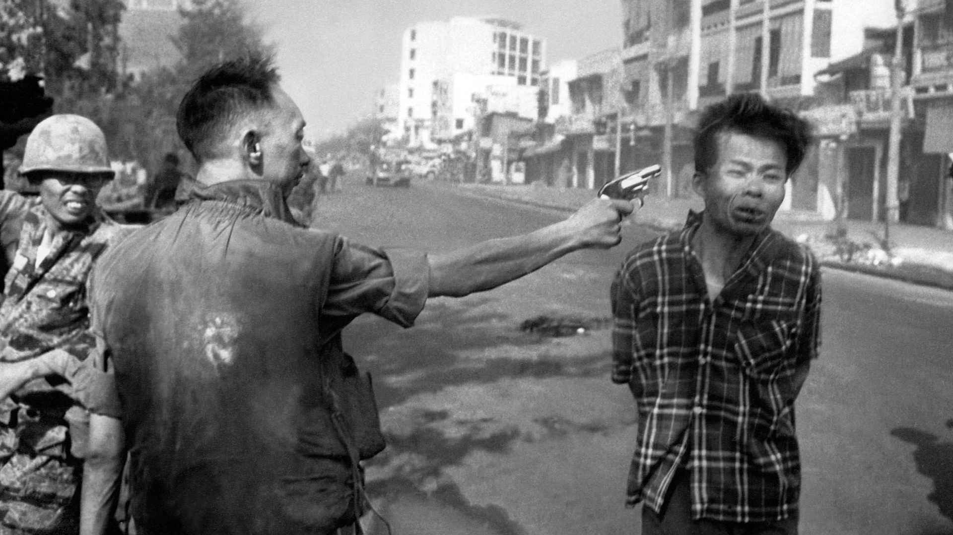 In this Feb. 1, 1968, file photo, South Vietnamese Gen. Nguyen Ngoc Loan, chief of the National Police, fires his pistol into the head of suspected Viet Cong officer Nguyen Van Lem (also known as Bay Lop) on a Saigon street