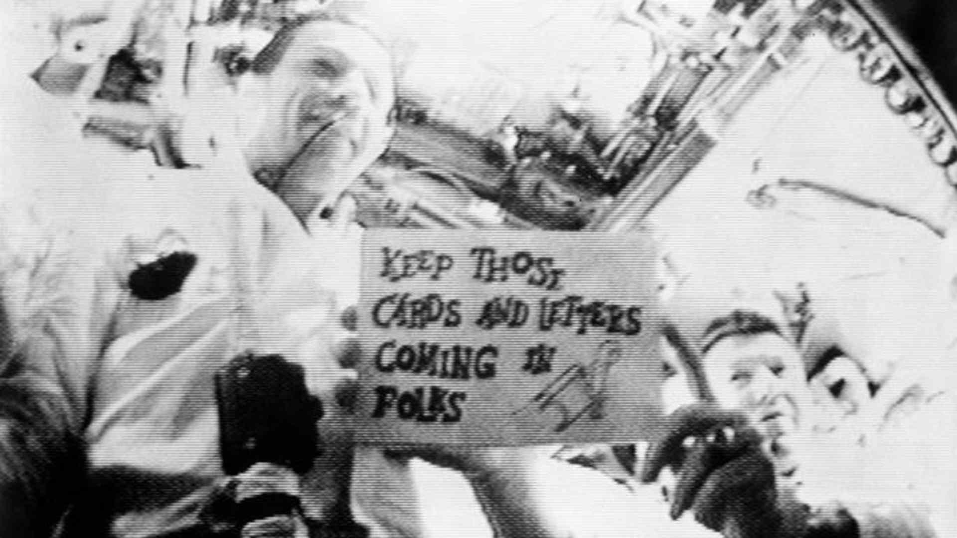 Astronauts Walter M. Schirra Jr. (on right) and Donn F. Eisele are seen in the first live television transmission from space. (Credit: NASA)