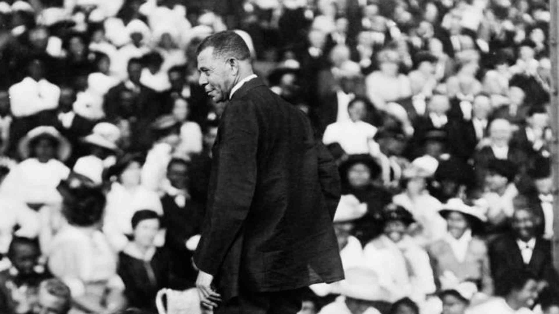 Booker T. Washington addressing a large crowd, circa 1910. 