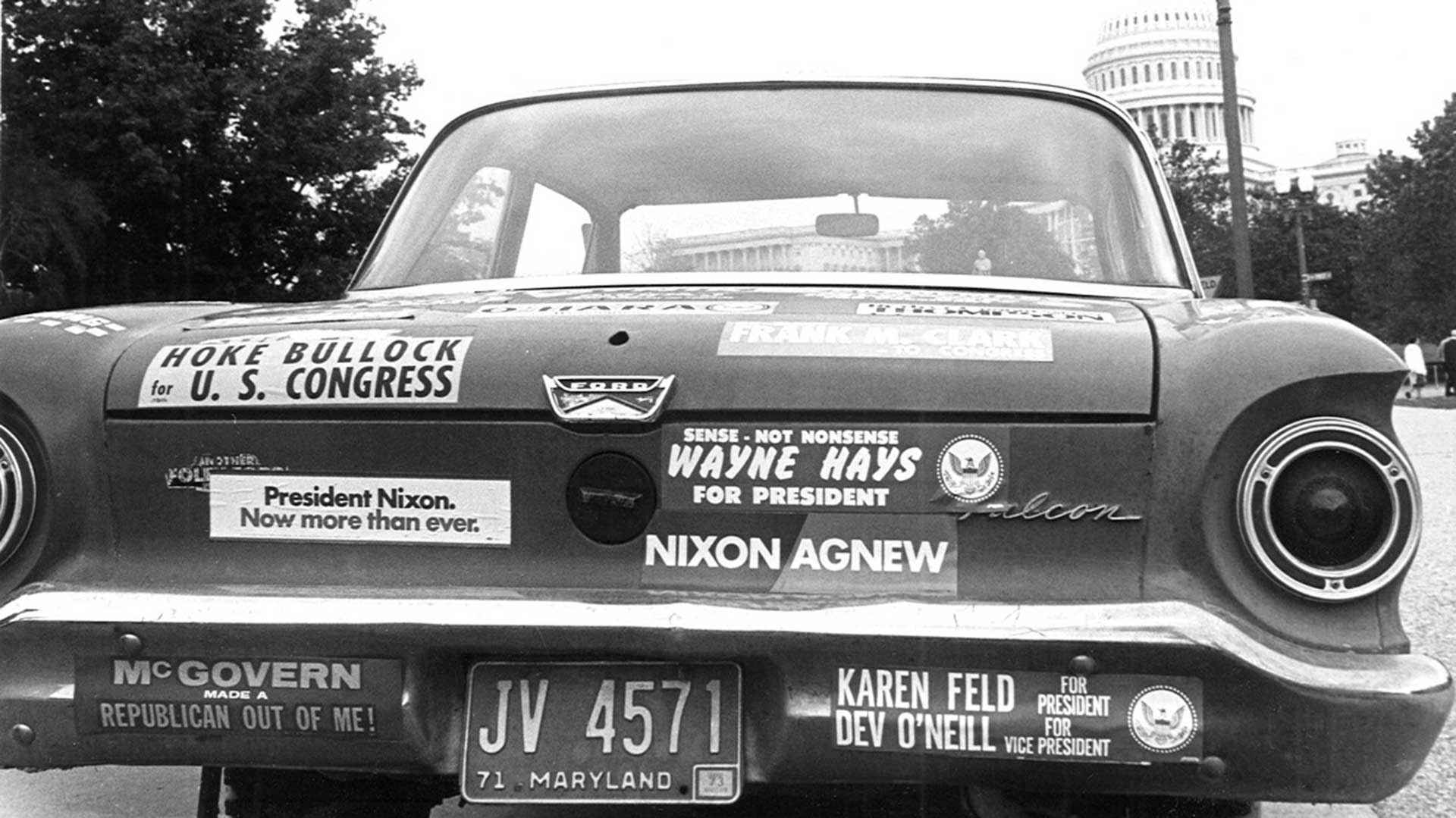 A car covered in political bumper stickers is shown parked outside the Capitol Building in 1973.