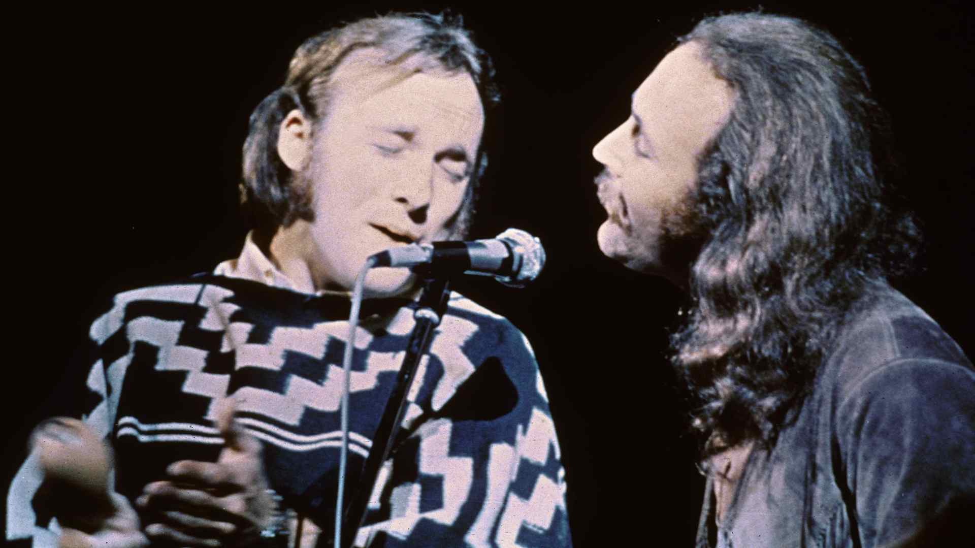 Stephen Stills (left) and David Crosby of the group Crosby, Stills, & Nash performs on stage at the Woodstock Music and Art Festival, Bethel, New York, August 17, 1969. (Photo by Fotos International/Getty Images)