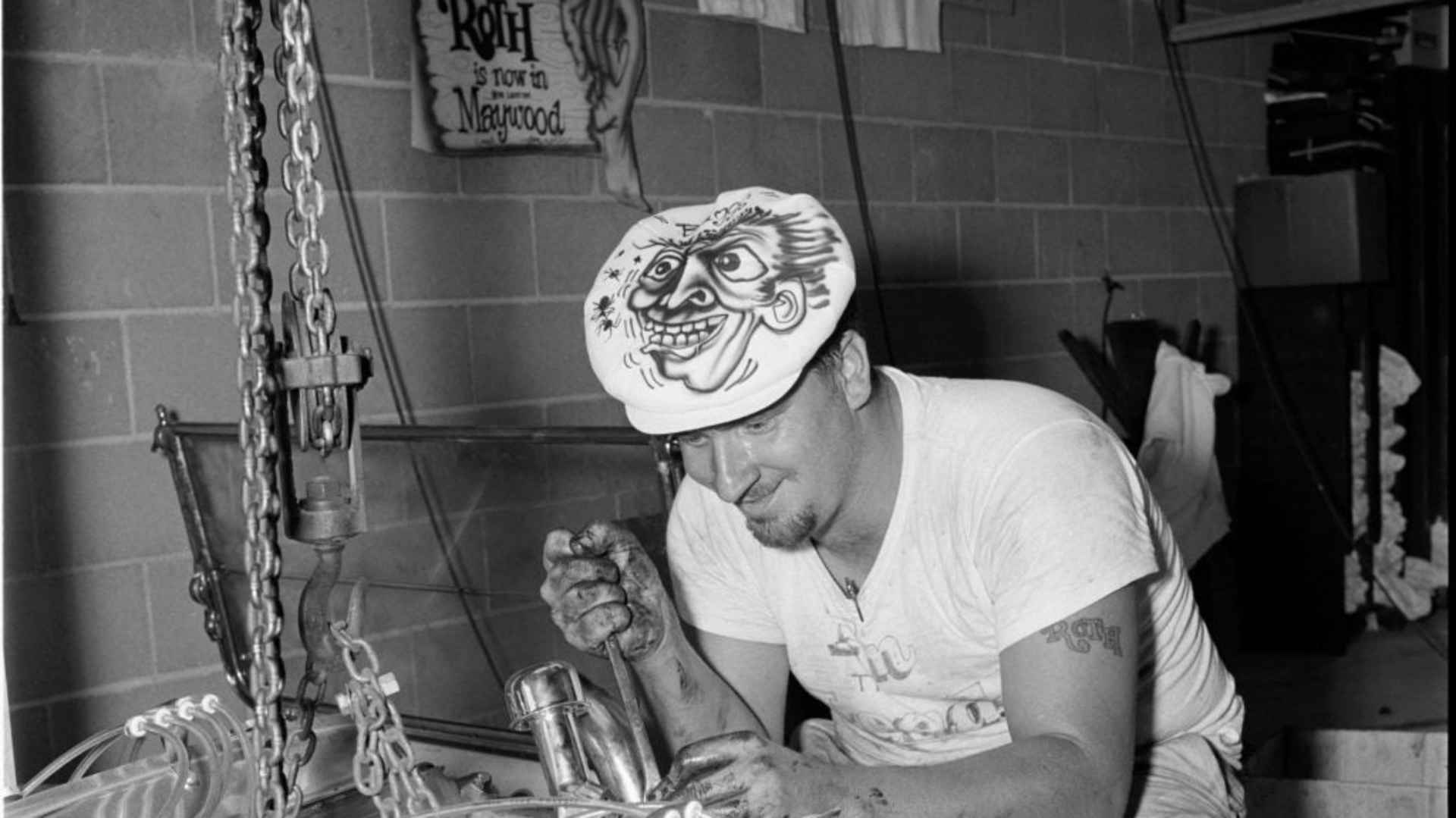 Ed Roth working on the Cadillac engine of his first complete fiberglass car, ‘Excaliber,’ later renamed ‘the Outlaw,’ in 1959.