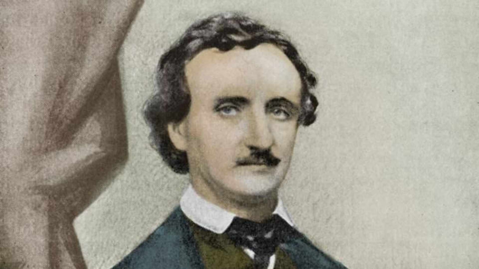 The image depicts a portrait of a man with a distinctive mustache and curly hair, set against a plain background.