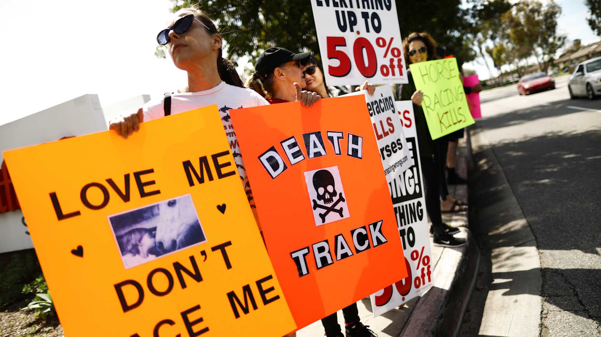 Animal rights activists protest horse racing deaths outside Santa Anita Park on March 10, 2019, in Arcadia, California.