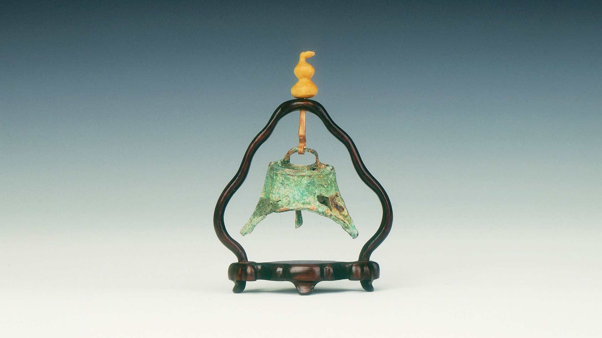 Miniature bronze bell with clapper, Xia dynasty, China, c. 2100 BC.