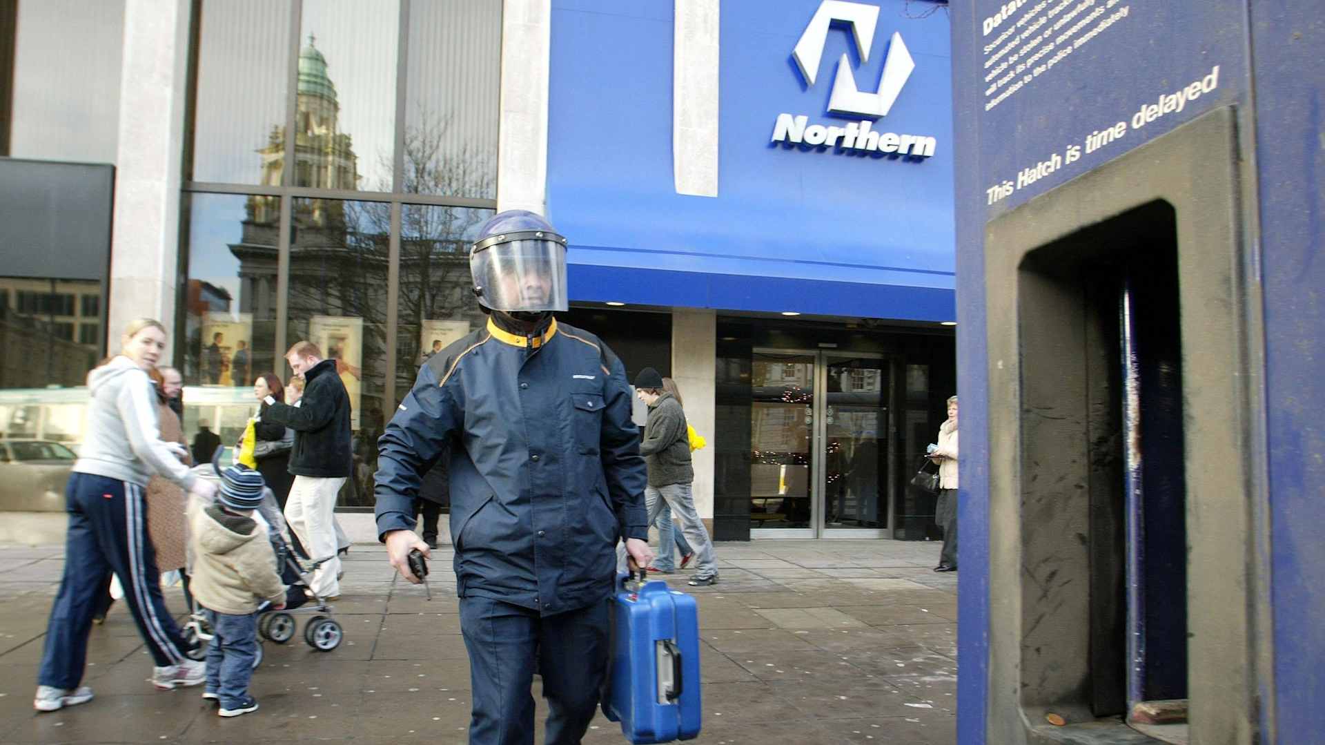 The scene at the Northern Bank headquarters in Belfast after a gang got away with at least 20 million British pounds in a raid. Two senior bank staffers and their families were held hostage at their homes outside the city as part of an elaborate plan to raid the bank's cash center.
