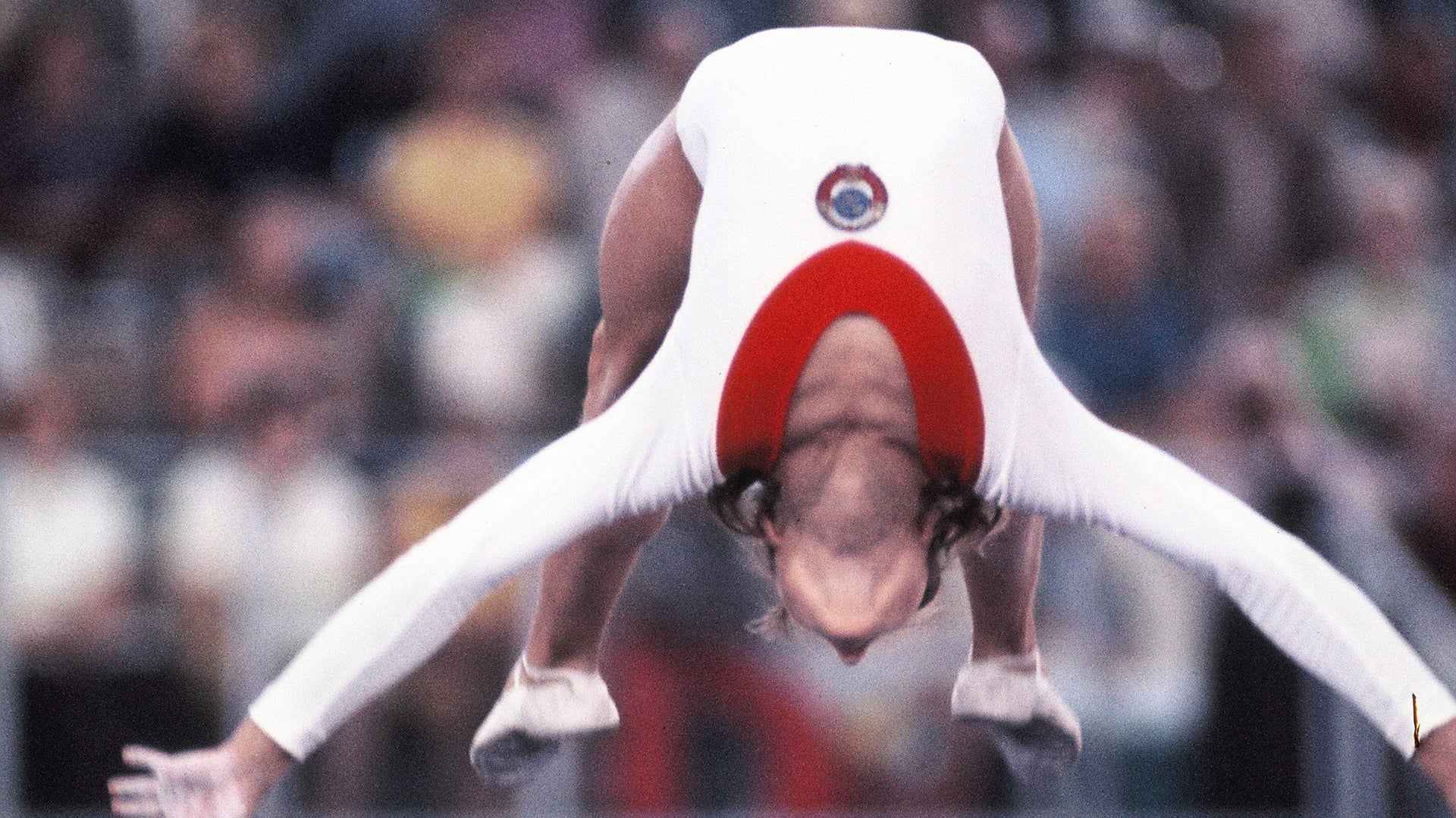 MUNICH, WEST GERMANY - SEPTEMBER 01: Olga Korbut of the Soviet Union competes in the Balance Beam of the Artistic Gymnastics Women's Apparatus final during the Munich Olympic Games at the Sporthalle on September 1, 1972 in Munich, West Germany.