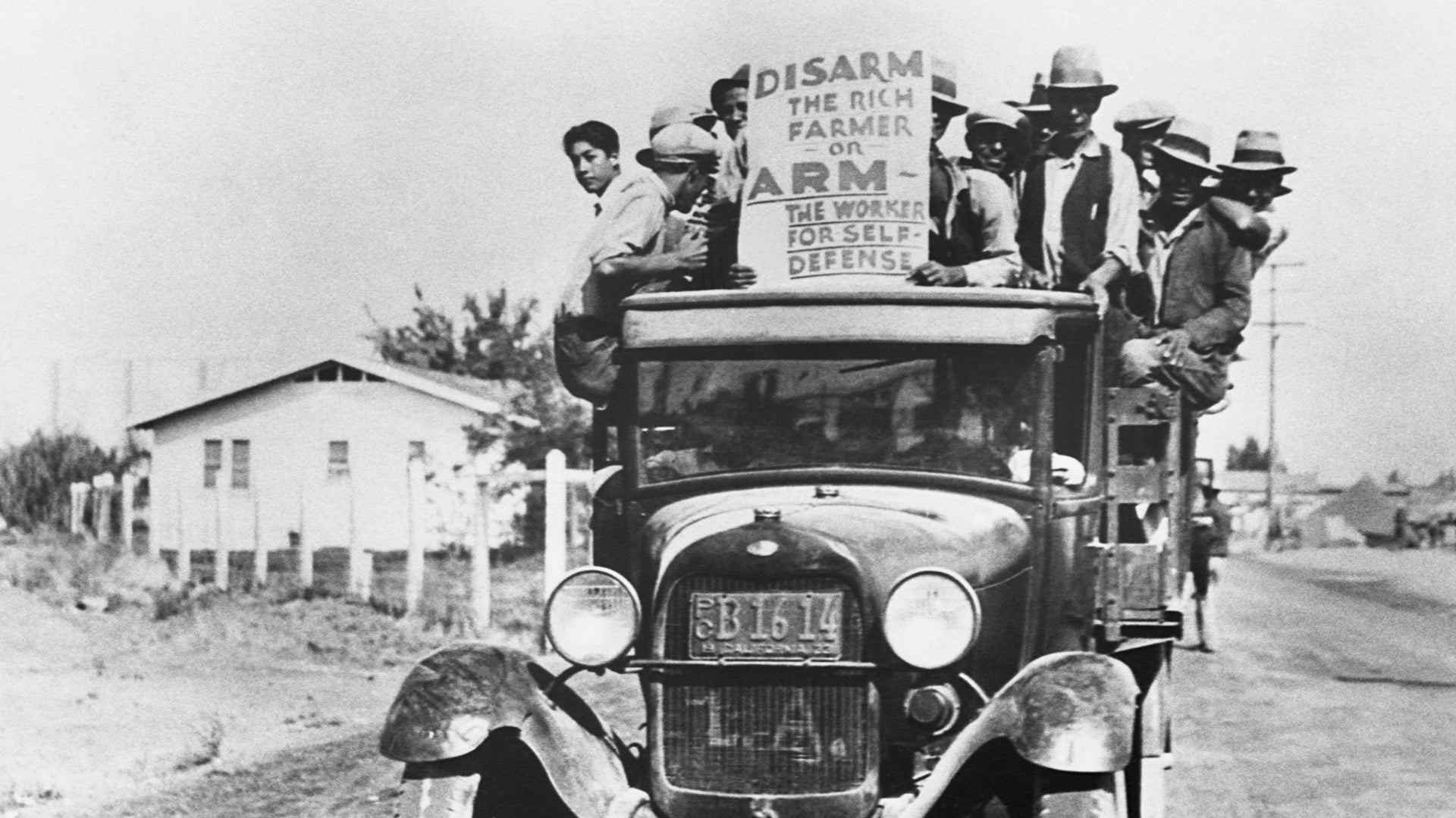 A group of Mexican farm workers protest from the back of a truck during a strike in California, 1933.
