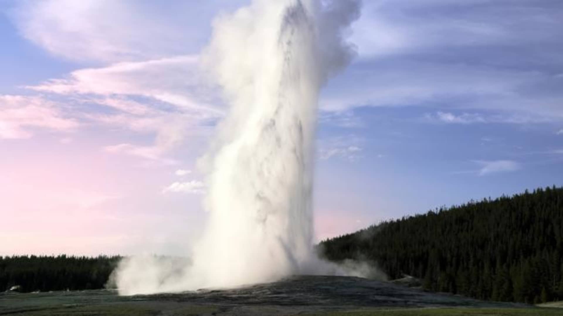 Most popular geyser in the world, the Old Faithful geyser in the Yellowstone National Park. USA.