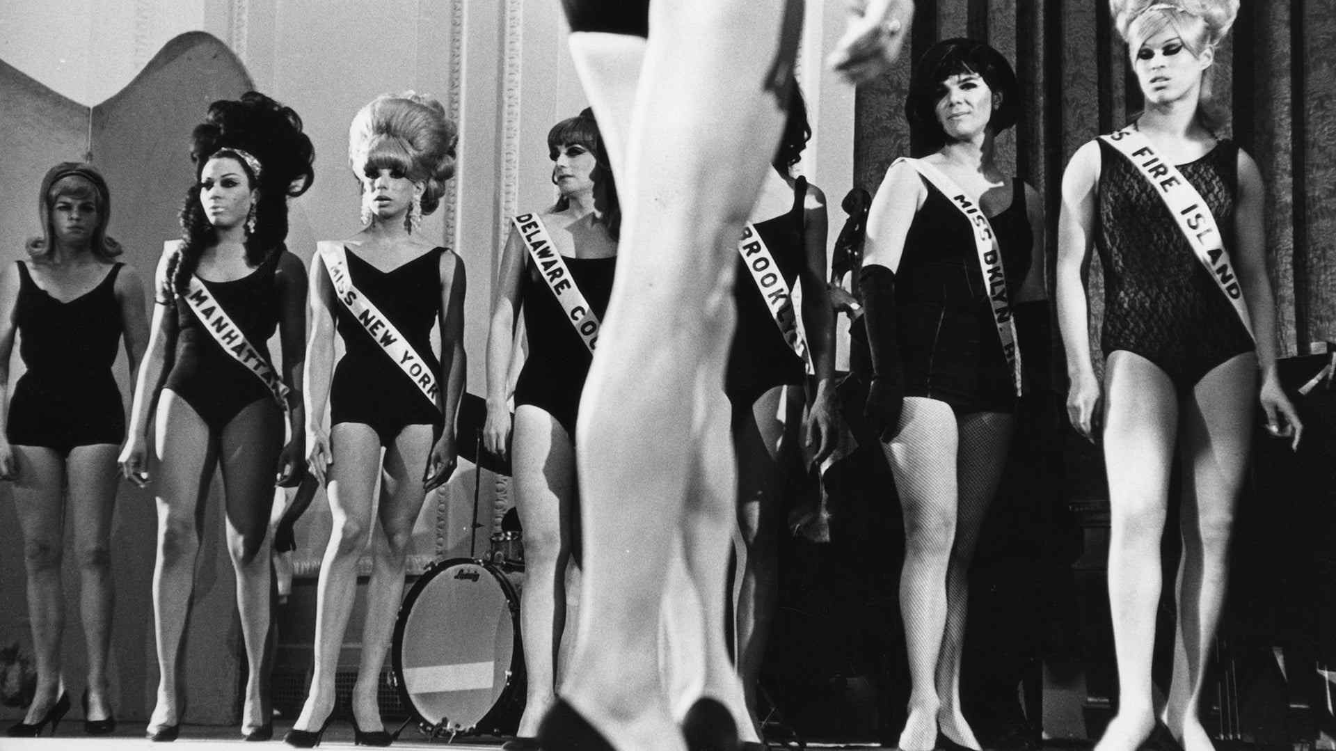 View of a line of drag performers onstage as they compete during a beauty contest, New York, New York, February 20, 1967. Among those pictured are Miss Manhattan, Miss New York, Miss Delaware County, Miss Brooklyn, and Miss Fire Island.