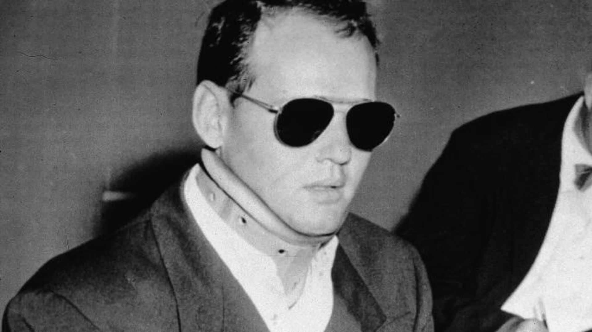 Sam Sheppard, wearing a neck brace, while on trail for the murder of his wife in 1954. (Credit: Hulton Archive/Getty Images)
