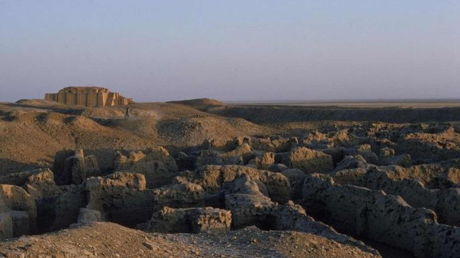 Weathered remains of a partially restored ziggurat and the ruins of the city of Ur. (Credit: David Lees/The LIFE Images Collection/Getty Images)