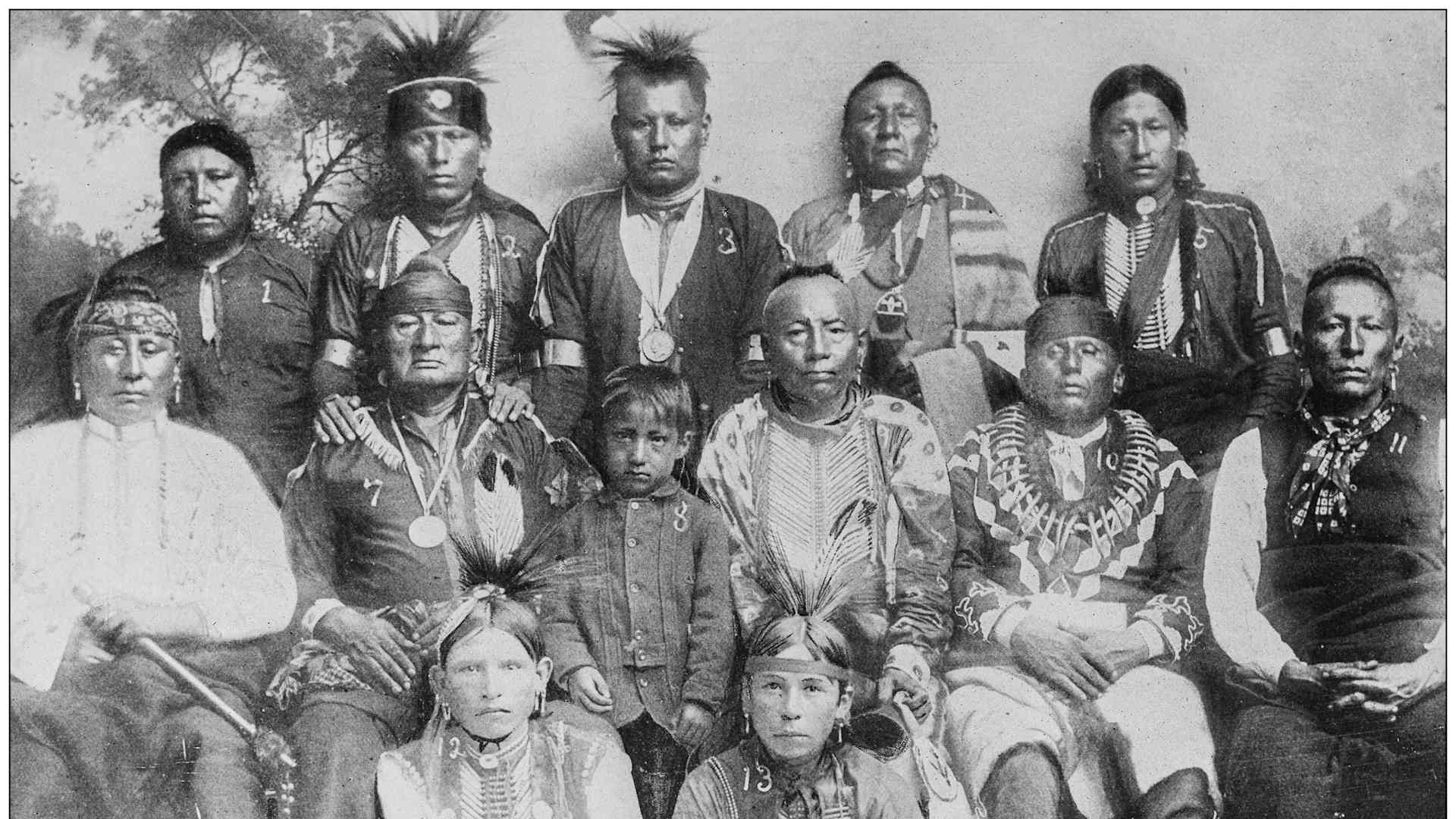 Antique historical photographs from the US Navy and Army: three rows of Osage Indians standing and sitting