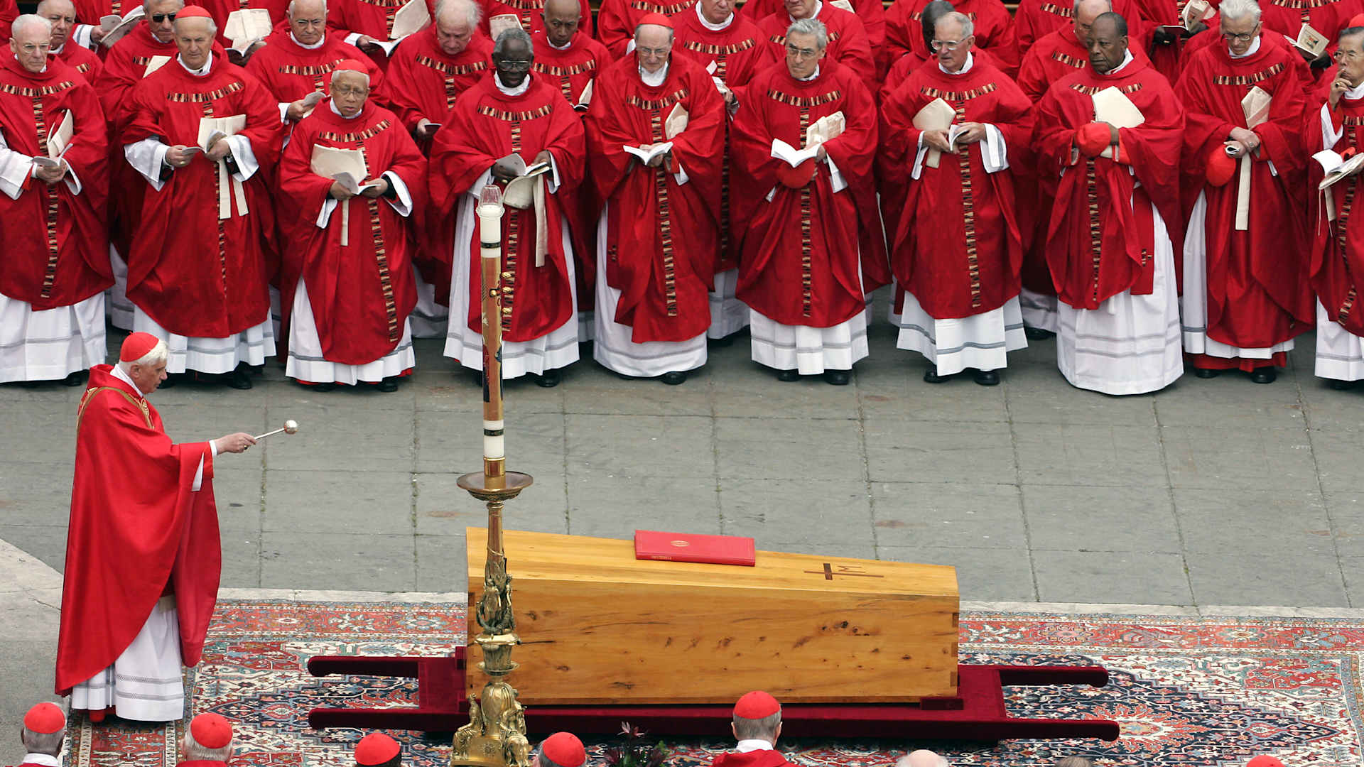 German Cardinal Joseph Ratzinger blesses the coffin of Pope John Paul II during his funeral mass in St Peter's Square at the Vatican City on April 8, 2005.  