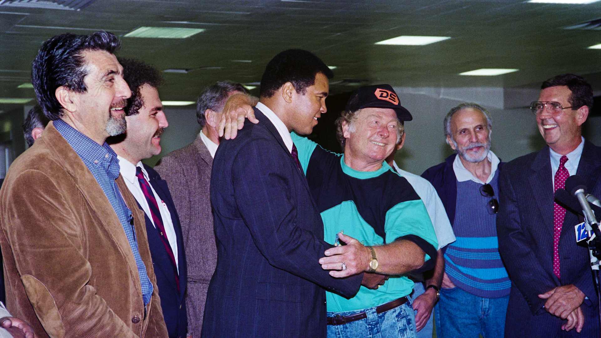 Released hostage Royce Smart gives former heavyweight world boxing champion Muhammad Ali a hug, on December 04, 1990 after his arrival at Kennedy International airport. Ali was instrumental in the release of 15 U.S. hostages held captive in Iraq. 