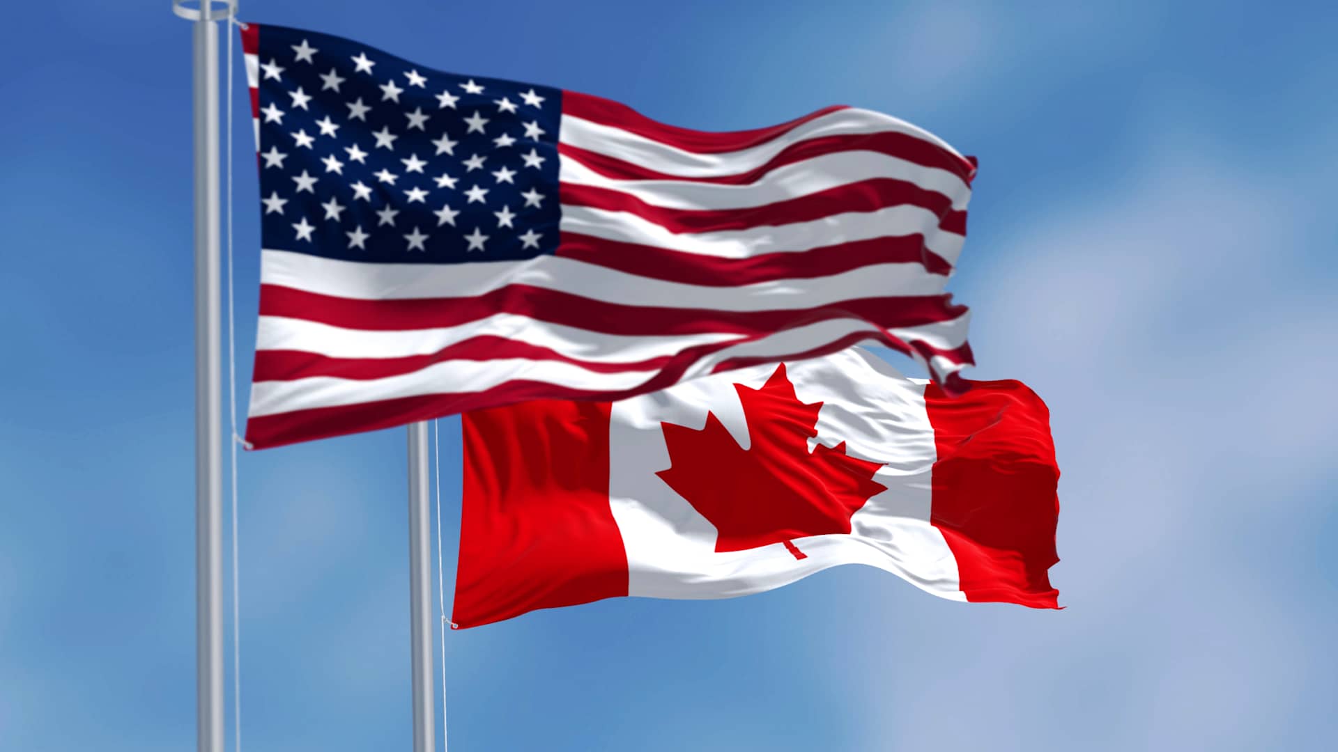 U.S. and Canadian flags.