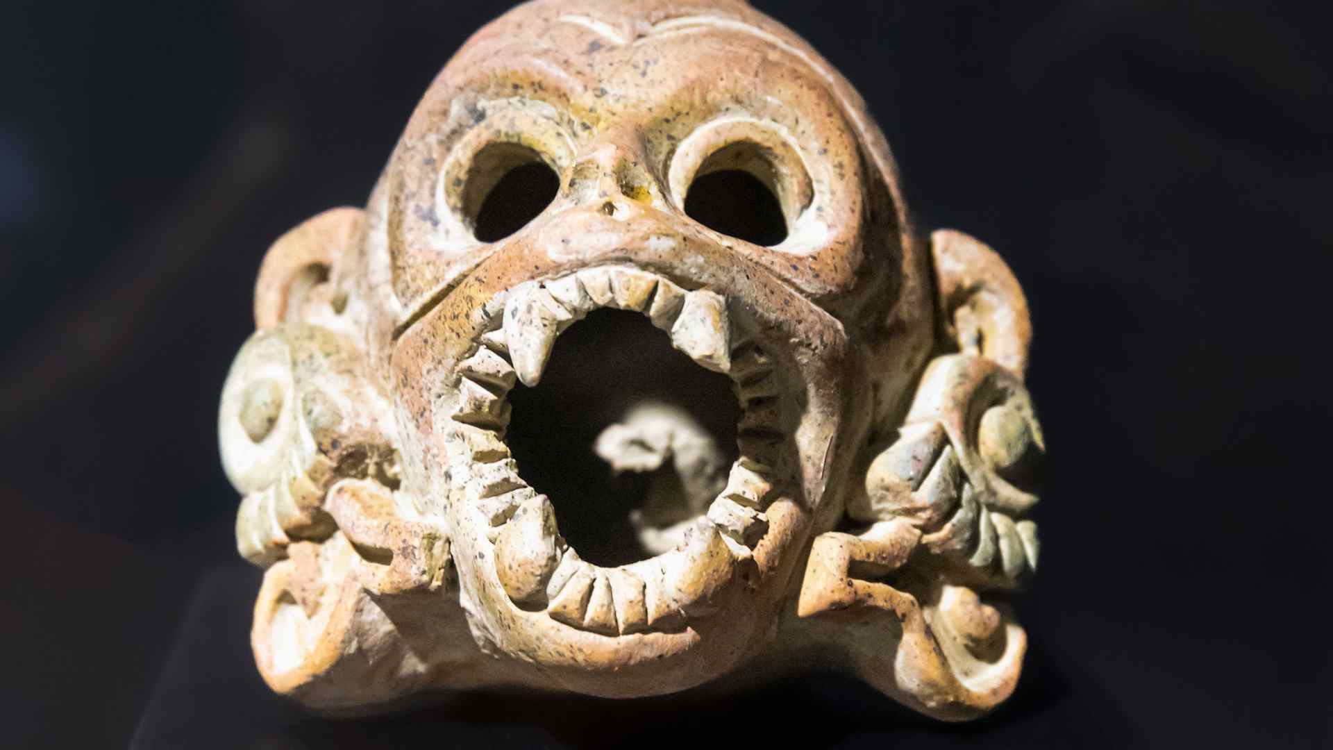 An Aztec death whistle in the shape of a human skull.  When blown, a death whistle emits a realistic shriek, or scream.
