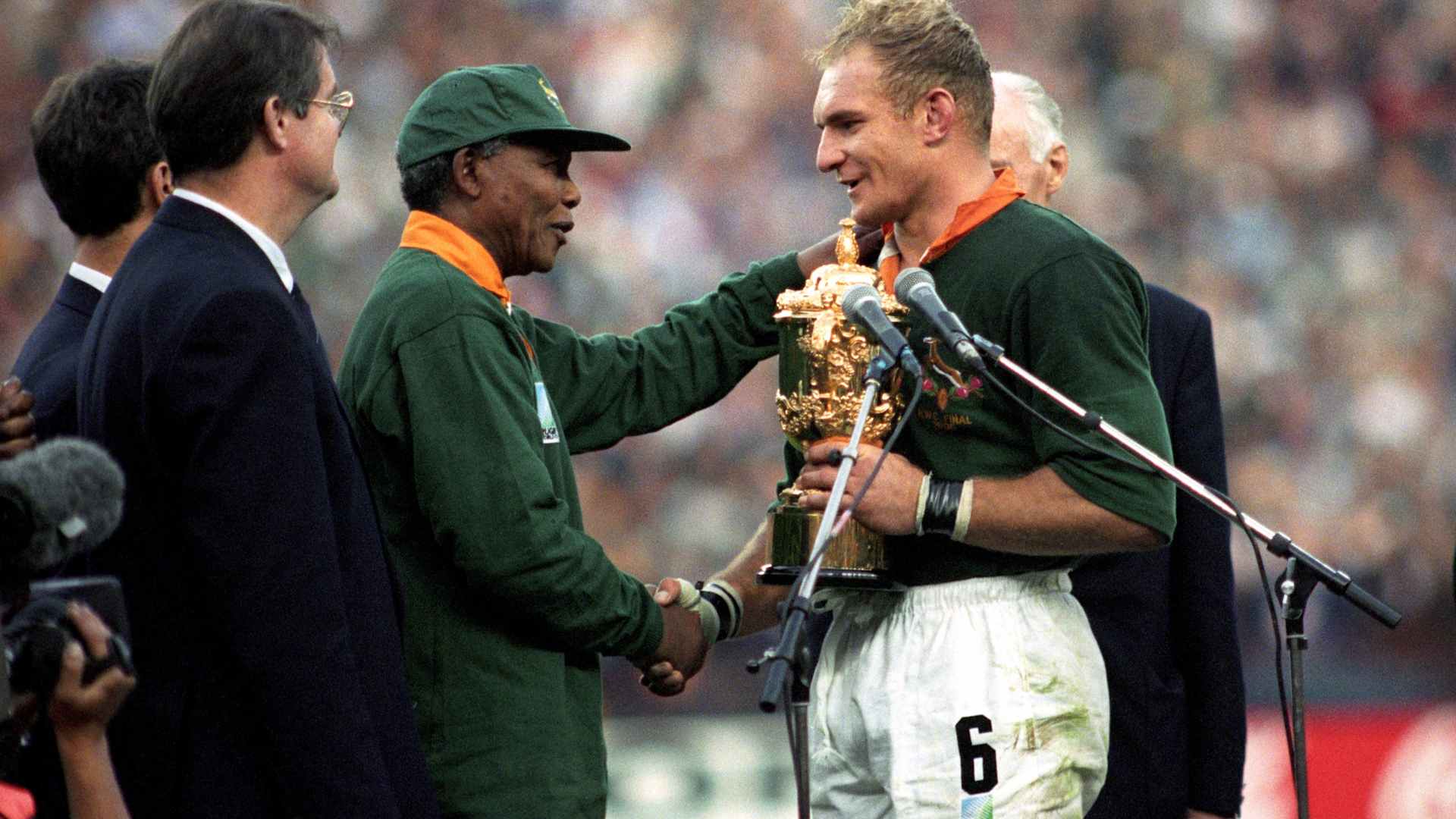 South Africa captain Francois Pienaar receives the William Webb Ellis Trophy from President Nelson Mandela after the home team defeated arch rival New Zealand in the 1995 Rugby Union World Cup in Johannesburg.