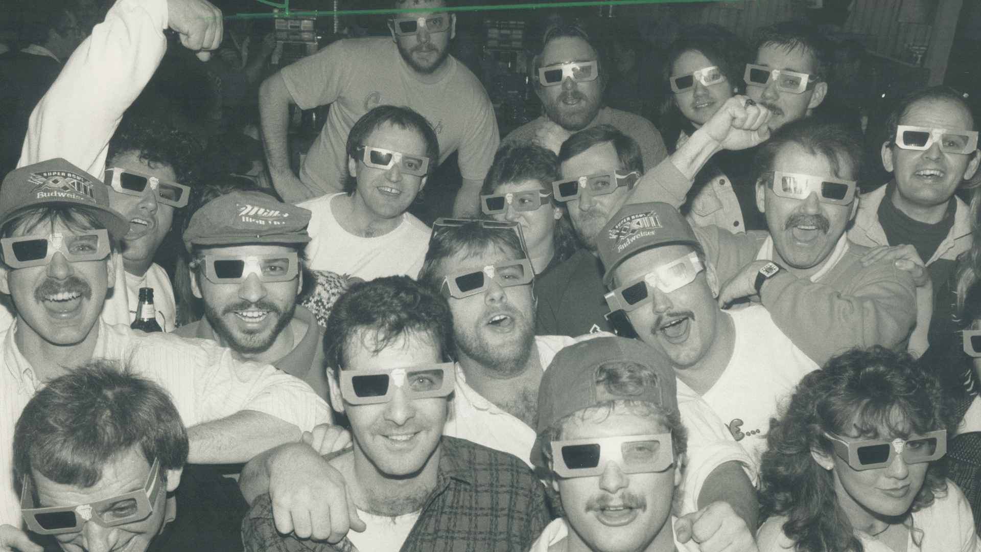 Super Bowl fans party in Metro as they watch the half-time through 3-D glasses. Most at K. C. McFly's tavern on Victoria Park Ave. yesterday backed the 49ers and went wild at the last-minute 20-16 win over the Bengals. (Photo by Colin McConnell/Toronto Star via Getty Images